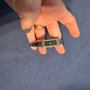 Women’s Gucci stainless and black watch